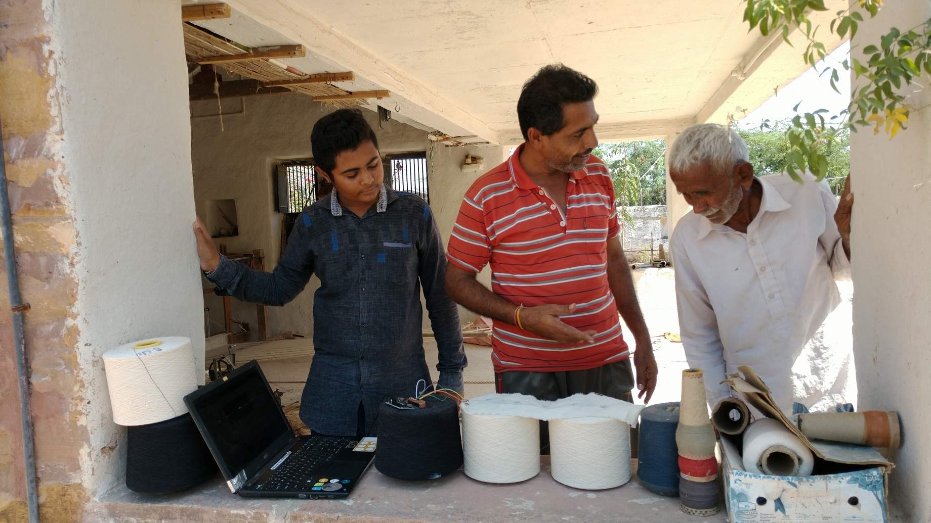 Craftsmen Interacting with Prototype